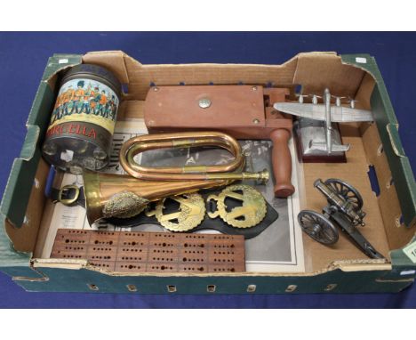 A mixed lot including a bugle, model canon and a vintage style tin
