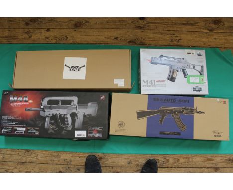 Four assorted Airsoft assault weapons, all boxed as new, as a post 1939 air weapon the restrictions of the Crime Reduction Ac