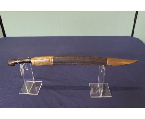 An Afghan 'Khyber knife' with its unusual brass mounted leather scabbard