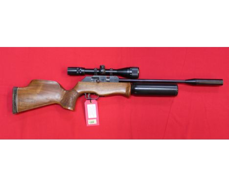 A Theoben 'Radid 7' air rifle with Nikko Stirling 4-12x40 scope, spare magazine and refill air cylinder, N.B. this is a Secti