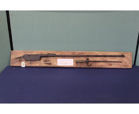 A collection of 'battlefield relics', a Lebel model 1886 rifle, Lebel bayonet and two rounds of ammunition, label reads 'Dug 