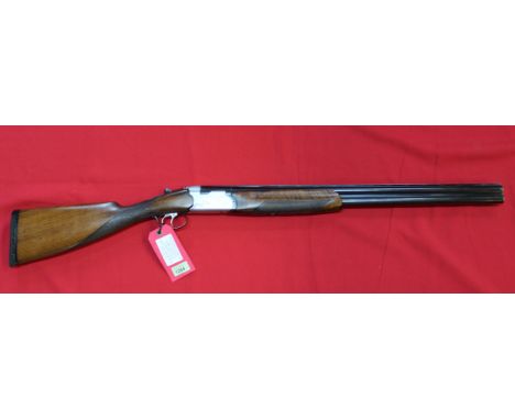 A 12 bore O/U shotgun by Beretta, double trigger, ejector and 26 1/2" barrels with clean bores, overall a quality used gun, t