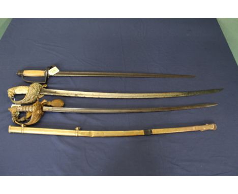 Three swords, one with brass scabbard (all as found)