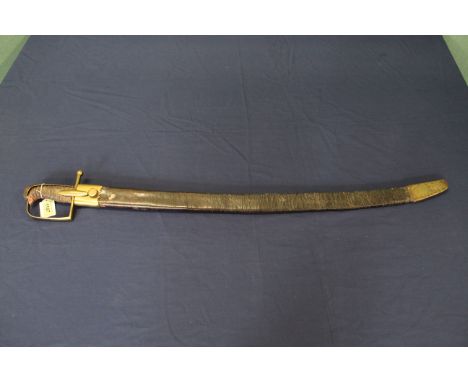A late 18th Century Cavalry sword within its brass mounted leather scabbard