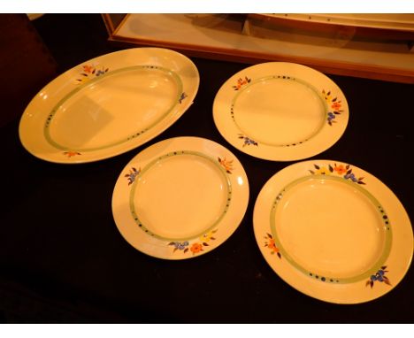 Four Clarice Cliff floral design ceramics including dinner plates