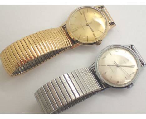 Two vintage Timex manual wind wristwatches one stainless steel one gold plated