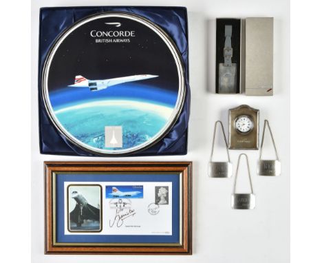 * Concorde. A collection of Concorde memorabilia, including a small timepiece by R Carr, presented in a silver frame engraved