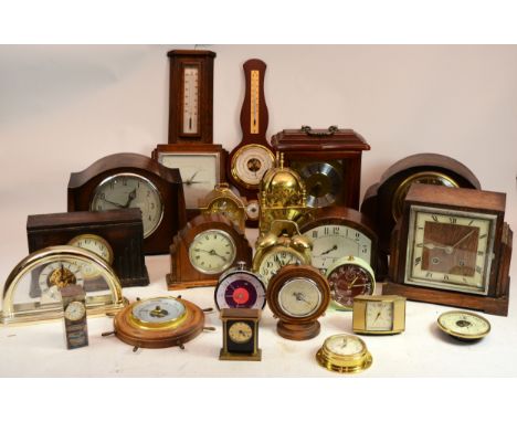 A collection of mid 20th century and later mantel clocks and barometers, having manual wind and quartz movements. (2)