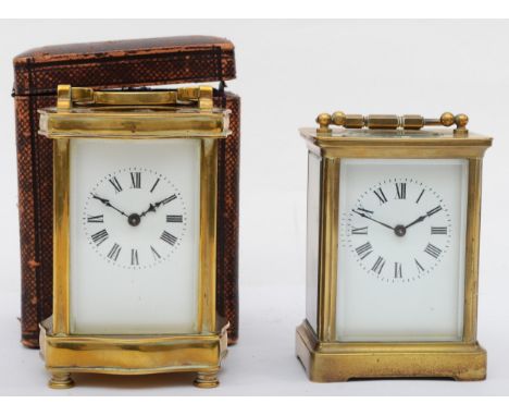 A 20th century brass cased carriage clock, 15cm high, together with a 20th century brass cased mantle clock, 14cm high (2)
