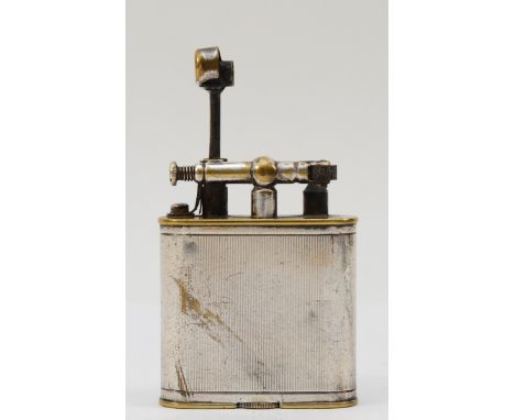 A 1920s Dunhill Unique lift arm pocket cigarette lighter, 5.5cm tall.