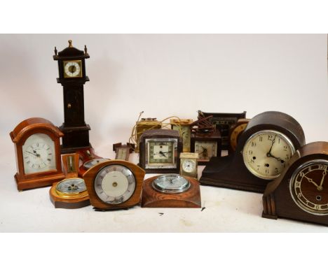 A collection of mid 20th century and later mantel clocks and barometers, having manual wind and quartz movements to include a