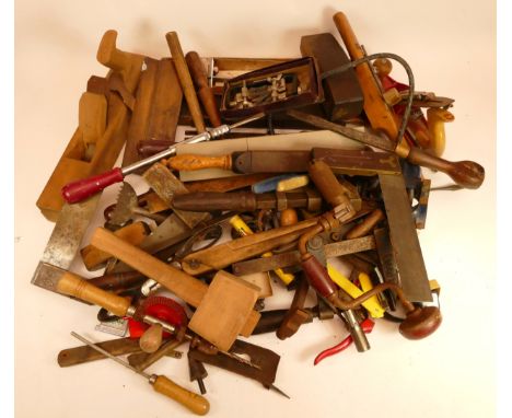 A collection of early 20th century and later carpenters hand tools, to include box planes, Stanley planes, drills, saws and o