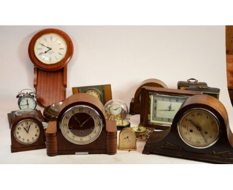 A collection of mid 20th century and later mantel clocks and barometers, having manual wind and quartz movements. (2)