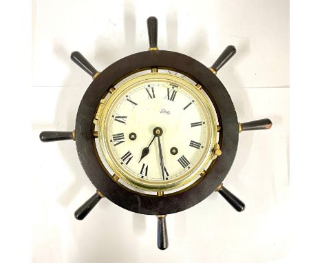 A 20th century Schatz brass cased bulkhead clock mounted a black 'ships wheel' frame, 32cm diameter.