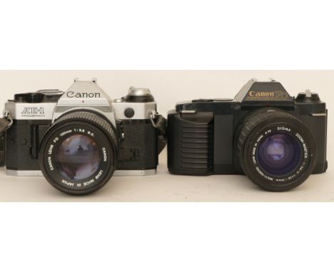 A Canon AE-1 camera with a Canon FD 135mm 1:3.5 lens and a Canon T50 with a Sigma 1:2.8-4 f=35-70mm lens (2)