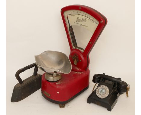 A mid 20th century countertop set of scales by Berkel of London, together with a solid cast iron, and an early bakelite telep