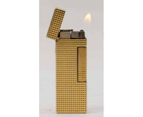 A gold-plated Dunhill rollagas cigarette lighter, engine turned, with original hard case and instructions pamphlet.