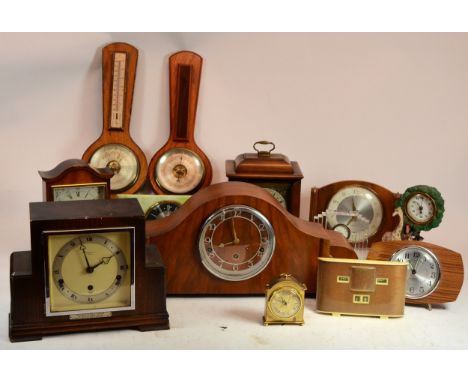 A collection of mid 20th century and later mantel clocks and barometers, having manual wind and quartz movements. (2)