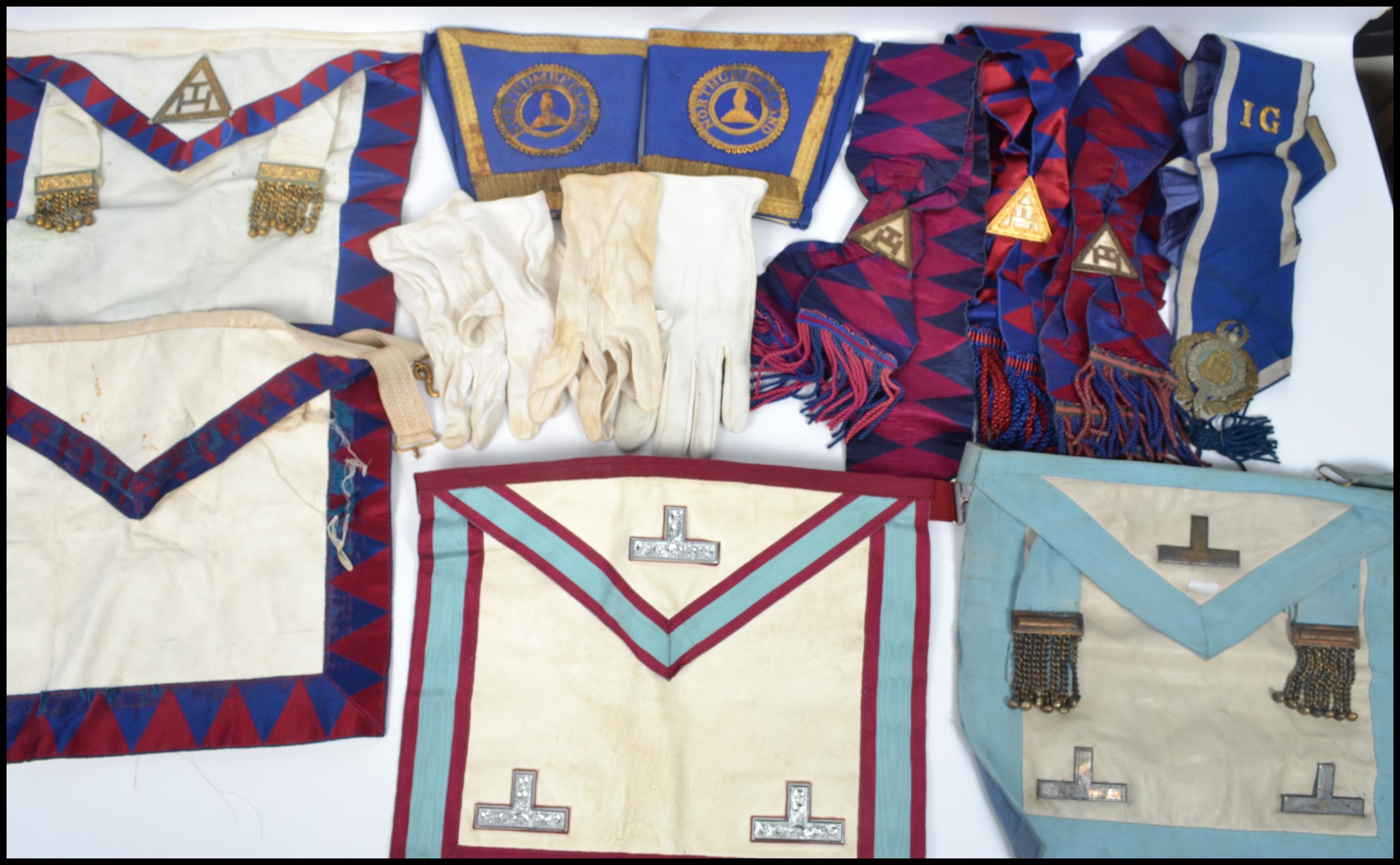 A good group of Masonic Regalia and items to include aprons, sashes