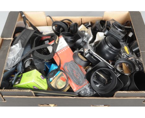 A Tray of Camera Accessories, including, light meters, lens hoods, caps, cables and other items 