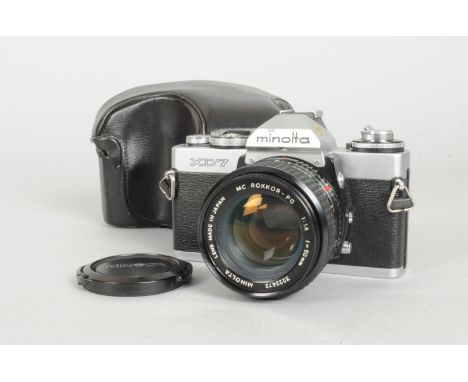 A Minolta XD7 SLR Camera, chrome, shutter working, body G-VG, with 50mm f/1.4 MC Rokkor lens, barrel G-VG, elements G-VG, som