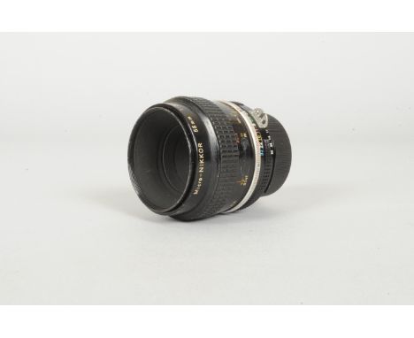 A Nikon Micro-Nikkor 55mm f/3.5 AI Lens,  serial no 852354, barrel G, scratches to filter ring, element G, internal dust 