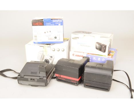 Digital Compact Cameras, a Canon Powershot A80, Samsung S850, Nikon Coolpix 4300, Olympus D-320, all in makers boxes and thre