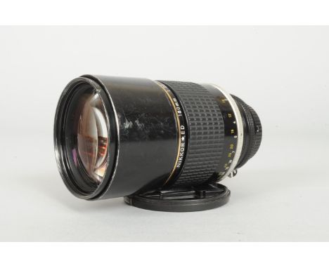 A Nikkon Niikor ED* 180mm f/2.8 AI-S Lens, serial no 435653, barrel F-G, scratches, brassing to mount ring, elements F-G, scr