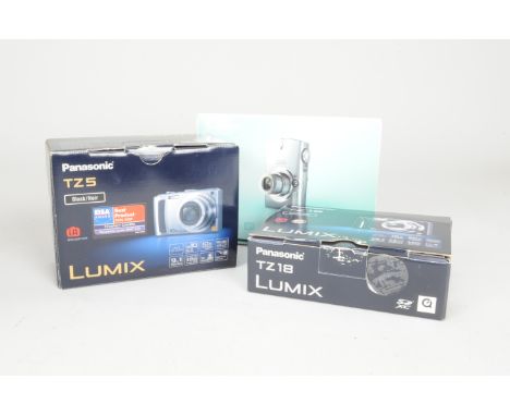 Digital Compact Cameras in Boxes, a Canon Digital Ixus 750, a black Panasonic TZ 5 Lumix and a Panasonic TZ 18 Lumix, with ma
