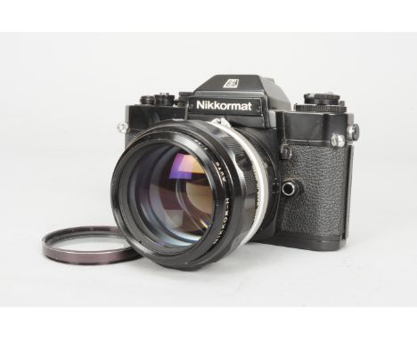 A Black Nikkormat EL SLR Camera, no. 5360569, shutter working, meter reacts to light, body G, with a Nikkor-H Auto 85mm f/1.8