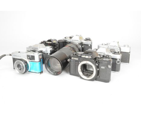 Olympus and Minolta SLR Cameras, comprising an OM10 camera with a Winder 2, an OM10 body, an OM30 camera, a Trip 35 compact c