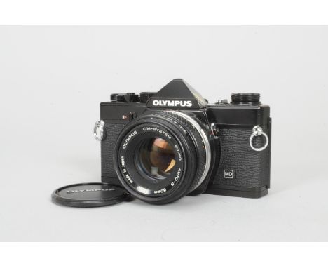 An Olympus OM-1n MD SLR Camera, black, shutter working, body G-VG, with Zuiko auto-s 50mm f/1.8 lens, barrel G-VG, elements G