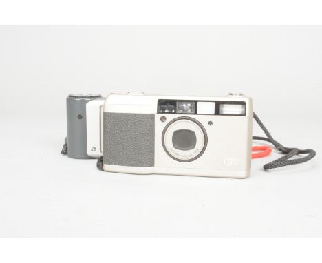 A Ricoh GR-1 Compact Camera, no. 104447, condition G, powers up, shutter working, otherwise untested, with a Pentax Efina APS