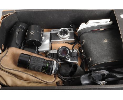 A Canon AV-1 SLR Camera and Accessories, no. 445091, shutter working, meter working, a Canon FD 50mm f/1.8 lens, a Sigma 100-