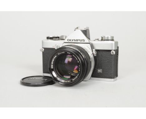 An Olympus OM-1n MD SLR Camera, chrome, shutter working, body G, with Zuiko 50mm f/1.4 lens, barrel VG, elements G, dust or o