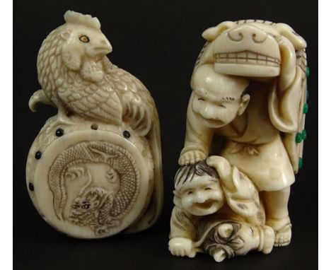 Lot of Two (2) Japanese Carved Ivory Netsukes. Both with Applied Enamel Decoration. Man & Child, One with Mythical Beast Cloa