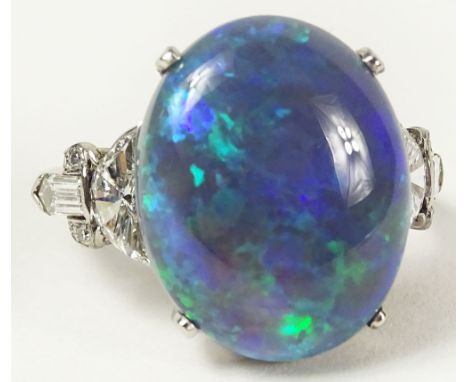 Ladies Vintage Black Opal, Platinum and Diamond Ring. The 7.32 Carat Center Stone with Lots of Fire, Flanked on Either Side b