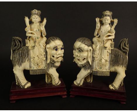 Pair of Antique Chinese Carved Ivory Guanyin Riding on Large Mythical Beasts. Inlaid With Turquoise, Lapis and Other Semi Pre