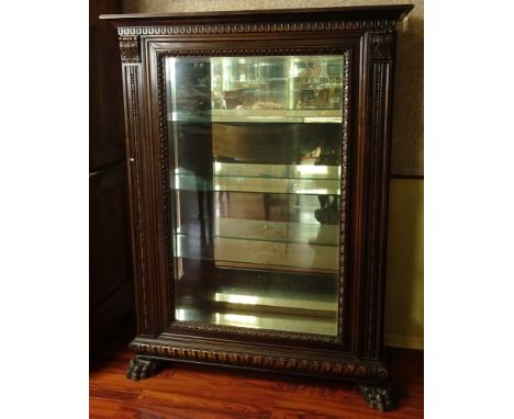 Late 19th Century Continental Carved Wood Vitrine with Large Carved Paw Feet and Beveled Glass. Unsigned. Minor Rubbing to Su