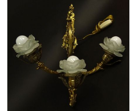 Modern Brass Three (3) Light Wall Sconce. Floral Frosted Glass Shades. Unsigned. Good Condition. Wall Mount Measures 13-1/2 I