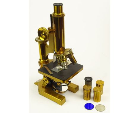 19/20th Century R & J Beck, London Brass Microscope #25490 in fitted wood box with accessories. Signed. Appears to be in good