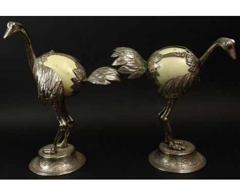 Pair of Antique Silver Plate and Ostrich Egg Ostrich Figurines. Unsigned. The Eggs are not set properly in the frame. They ha