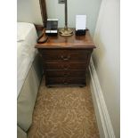 A Regency Style Mahogany And Flame Veneered Chest Of Drawers Fitted With A Brushing Slide And Four
