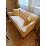 A Late Victorian Style Upholstered Sofa. Of Wedge Shaped Outline With Padded Arms And A Loose