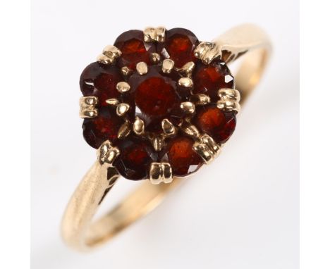 A 9ct rose gold garnet cluster ring, setting height 10.8mm, size R, 2.7gNo damage or repairs, all stones present, garnets hav