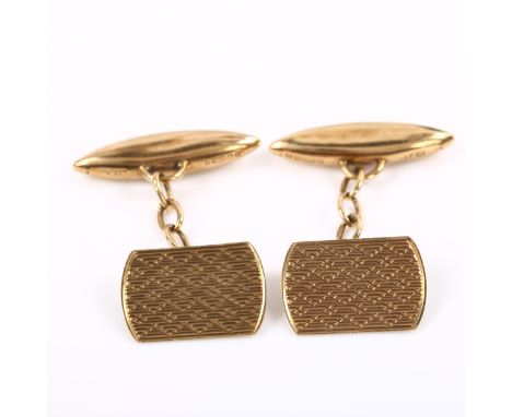 A pair of Art Deco 9ct gold cufflinks, engine turned curved rectangular and torpedo-shape panels, hallmarks Birmingham 1937, 