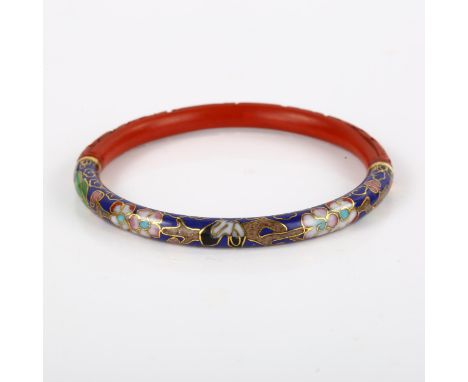 A Chinese cinnabar and cloisonne enamel slave bangle, band width 5.9mm, internal diameter 5.5cm, 15.5gNo damage or repairs, n