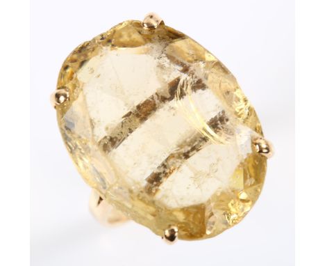 A large 14ct gold citrine dress ring, set with oval mixed-cut citrine, length 22.4mm, size M, 7gCitrine very heavily worn wit