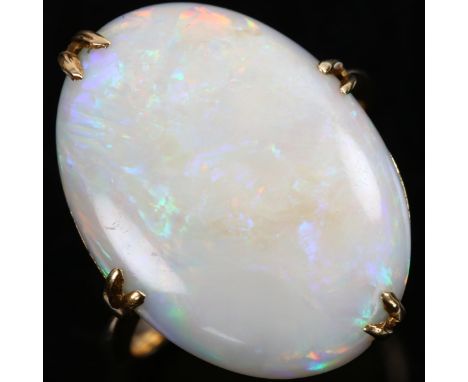 A late 20th century 18ct gold white opal dress ring, set with oval cabochon opal, setting height 21.4mm, size L, 4.3gNo damag