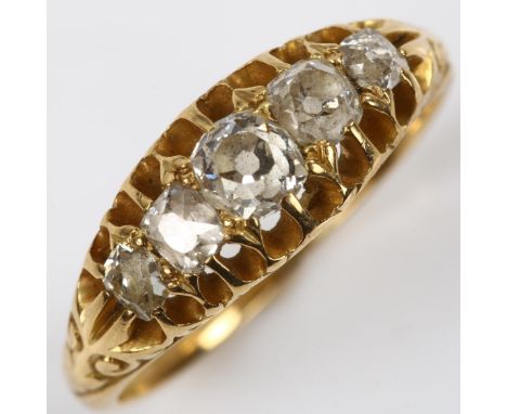 An early 20th century 18ct gold graduated five stone diamond half hoop ring, set with old-cut diamonds, total diamond content